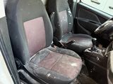 a van that has two seats and a steering wheel