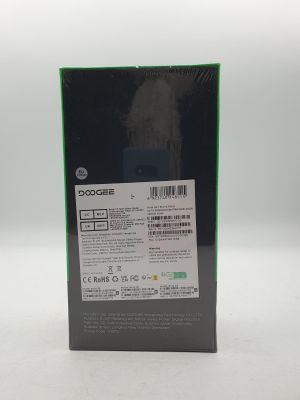 the back of a black box with a green and white label on it