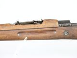 an old rifle with a wooden handle on a white background