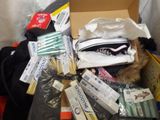 a box full of items that are sitting on a bed
