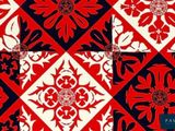 a red and white pattern with black and white flowers on it