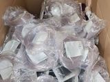 a cardboard box filled with lots of items that are wrapped in plastic