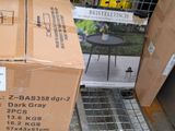 a cardboard box sitting on the ground next to a table