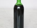 a bottle of wine that is sitting on a table