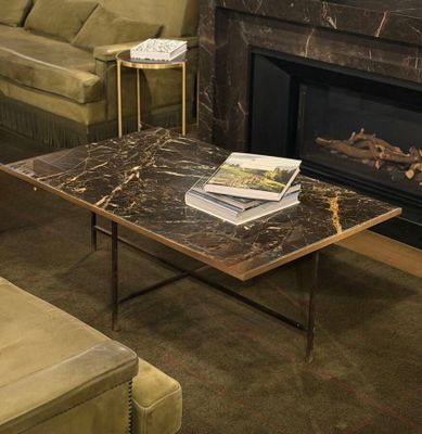 a coffee table with a book on top of it in a living room
