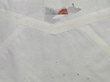 an old envelope with a piece of paper on top of it