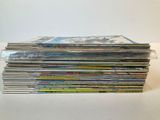 a lot of cds stacked on top of each other