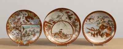 three plates with different designs on them sitting on a table