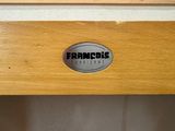 a close up of a wooden cabinet with a sign on it