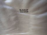 a close up of a white shirt with a logo on it