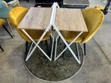 a table and chairs that are sitting on the floor