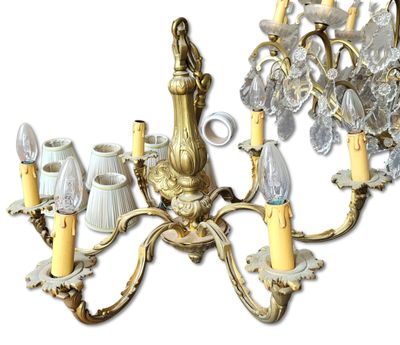 a chandelier that has five lights attached to it