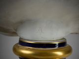 an image of a close up of a vase with a gold base