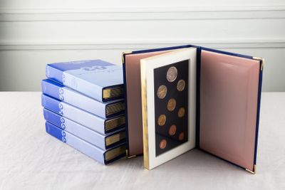 several books stacked on top of each other on a table