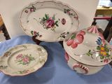 three plates and a bowl sitting on a table