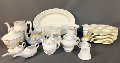 many white dishes and cups and saucers on the table