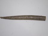 a close up of a metal object on a white surface