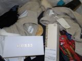 a pile of clothes and a box of clothes