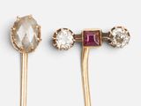 two pairs of gold tone ear pins with crystal stones