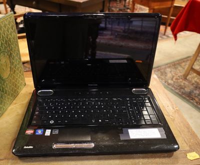 a laptop that is sitting on a table in a room