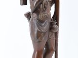 statue of a man with a cane and a woman holding a bag
