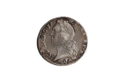 a close up of a coin on a white surface