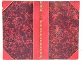 a red book with gold trim and a red cover