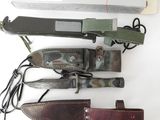 four different types of knives on a white surface