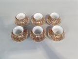 six coffee cups and saucers are sitting on a table