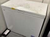 an image of a dirty refrigerator in a dirty bathroom