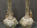 two vases that are sitting next to each other on a table