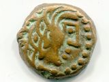 une vieille pièce de monnaie sur laquelle figure un lion, sur un fond blanc