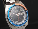 a watch that is sitting on a metal bracelet