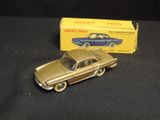 a toy car that is sitting next to a box