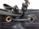 a close up of a black purse with two handles