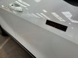 a close up of a car door with a sticker on it