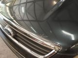 a close up of a black car with chrome trims