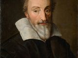 un tableau représentant un homme à la barbe blanche et vêtu d'une chemise noire