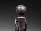 an image of a wooden figurine of a woman