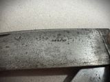 a close up of a knife that is on a table