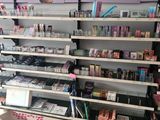 many shelves of cosmetics and makeup products in this store