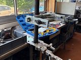 a picture of a workbench in a workshop with a lot of tools