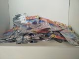 a pile of comic books sitting on a counter