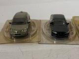three toy cars that are sitting on top of each other