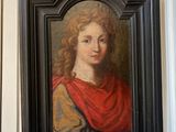 a picture of a painting on the wall above a clock