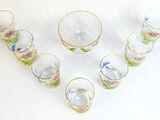 a group of glasses that are sitting on a table