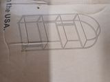 cardboard box with a drawing of a boat on it sitting on the floor