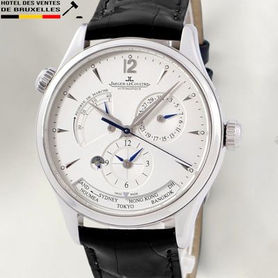 a close up of a wrist watch with a white dial