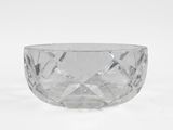 a clear glass bowl sitting on top of a white surface