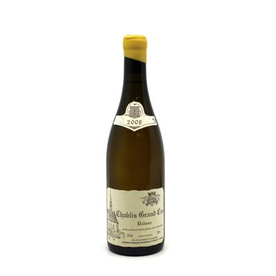a bottle of wine that is sitting on a table